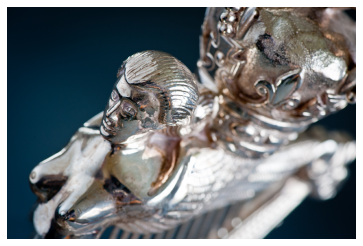 Detail of a silver Royal Irish Regiment cap badge sculpture Detail of a silver Royal Irish Regiment cap badge sculpture